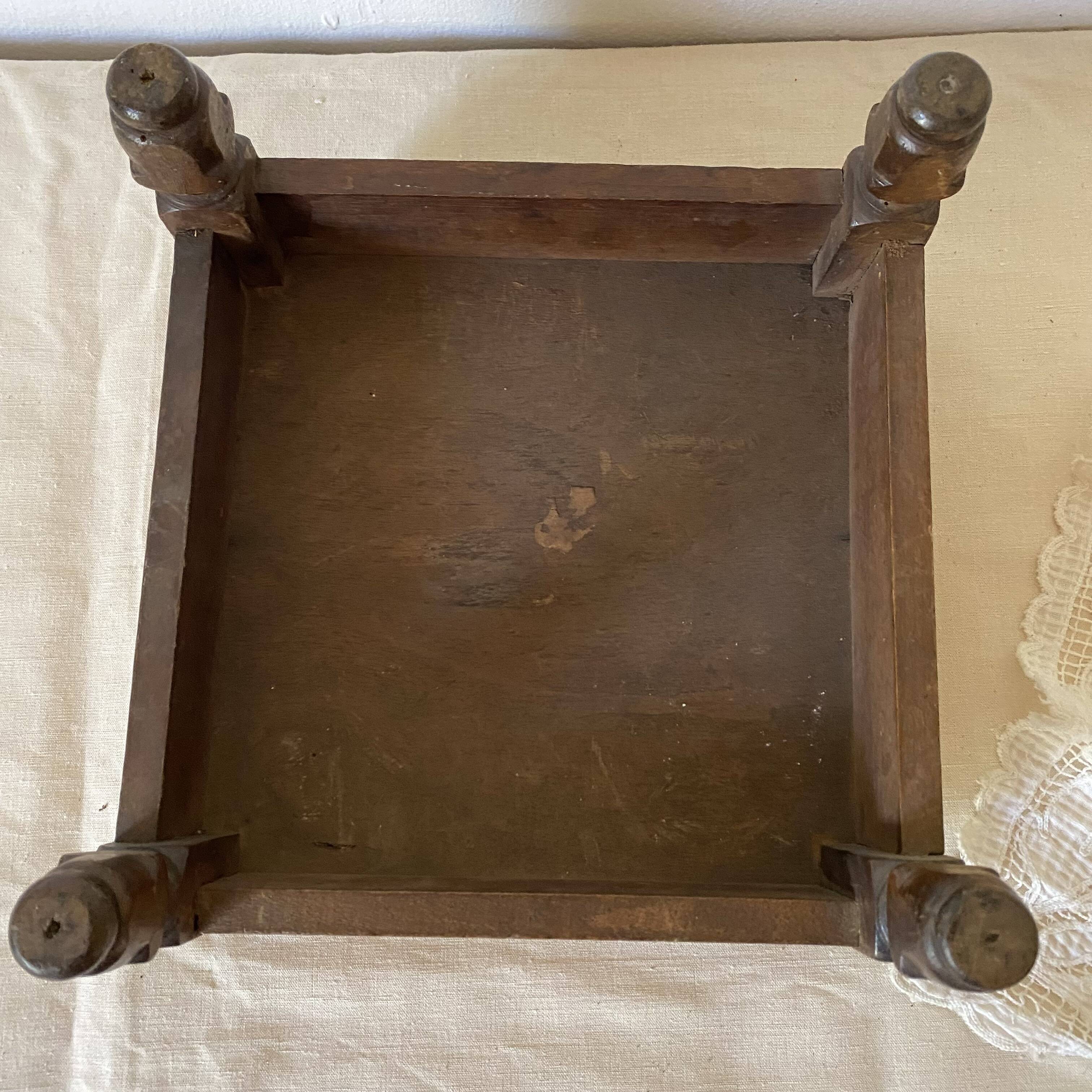 Low stool with antique wood and fabric footrest