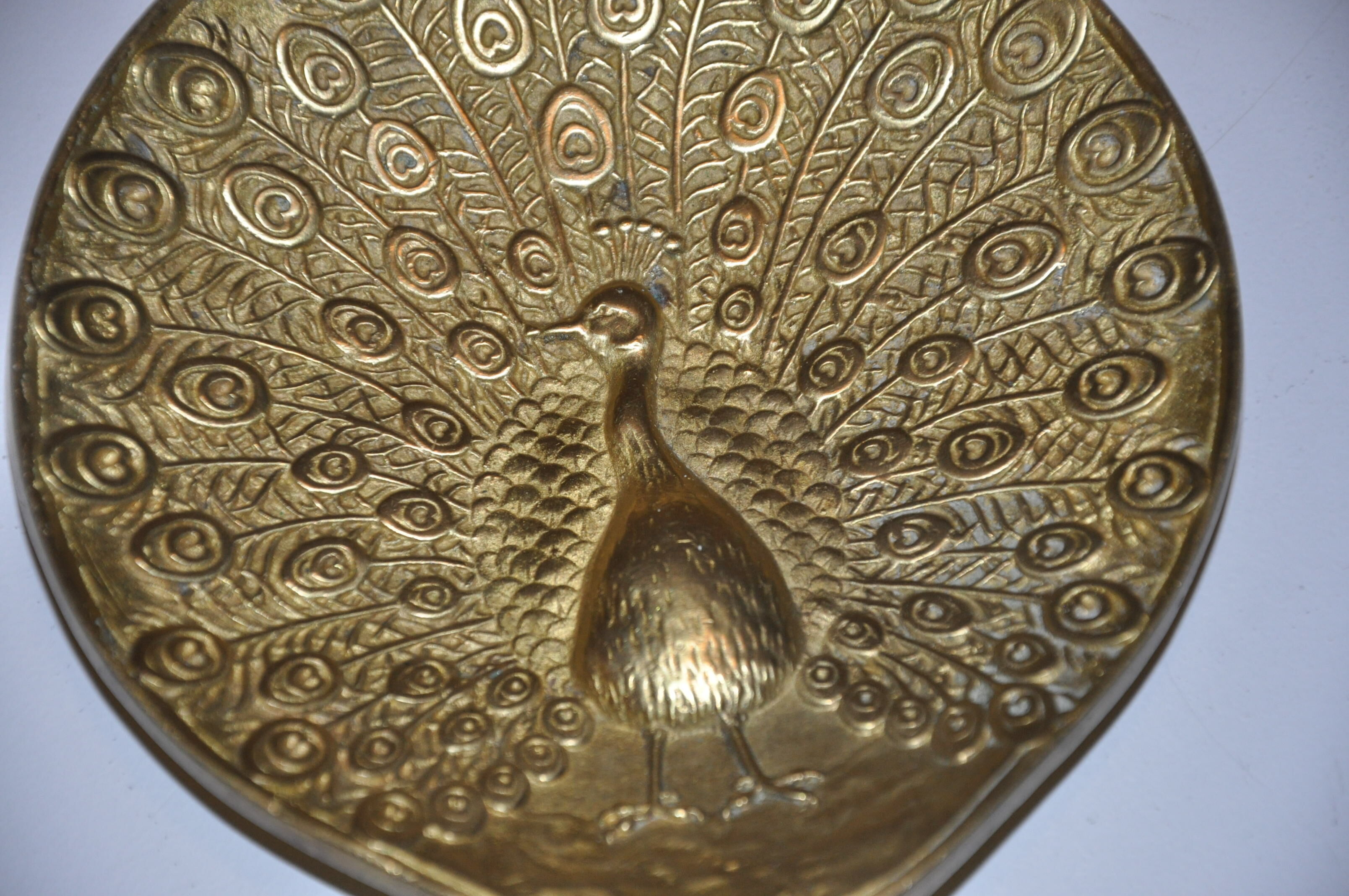 Brass pocket with peacock decoration
