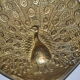 Brass pocket with peacock decoration