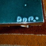 Coffee table with ceramic top signed