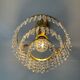 Chandelier with crystal and brass pendants