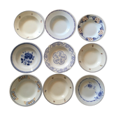 Old hollow plates in blue and brown of renowned earthenware