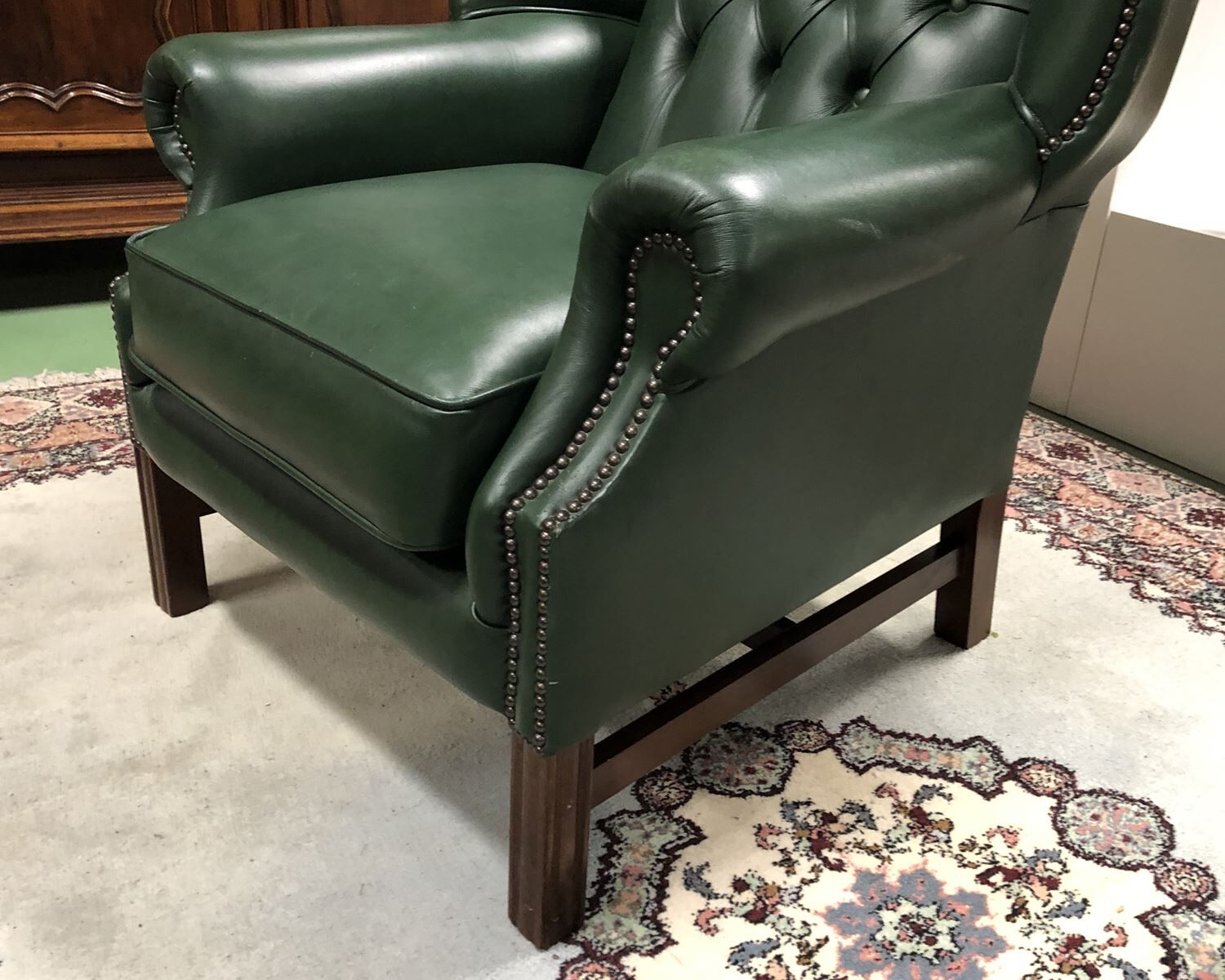 In the 1970s green leather Chesterfield armchair