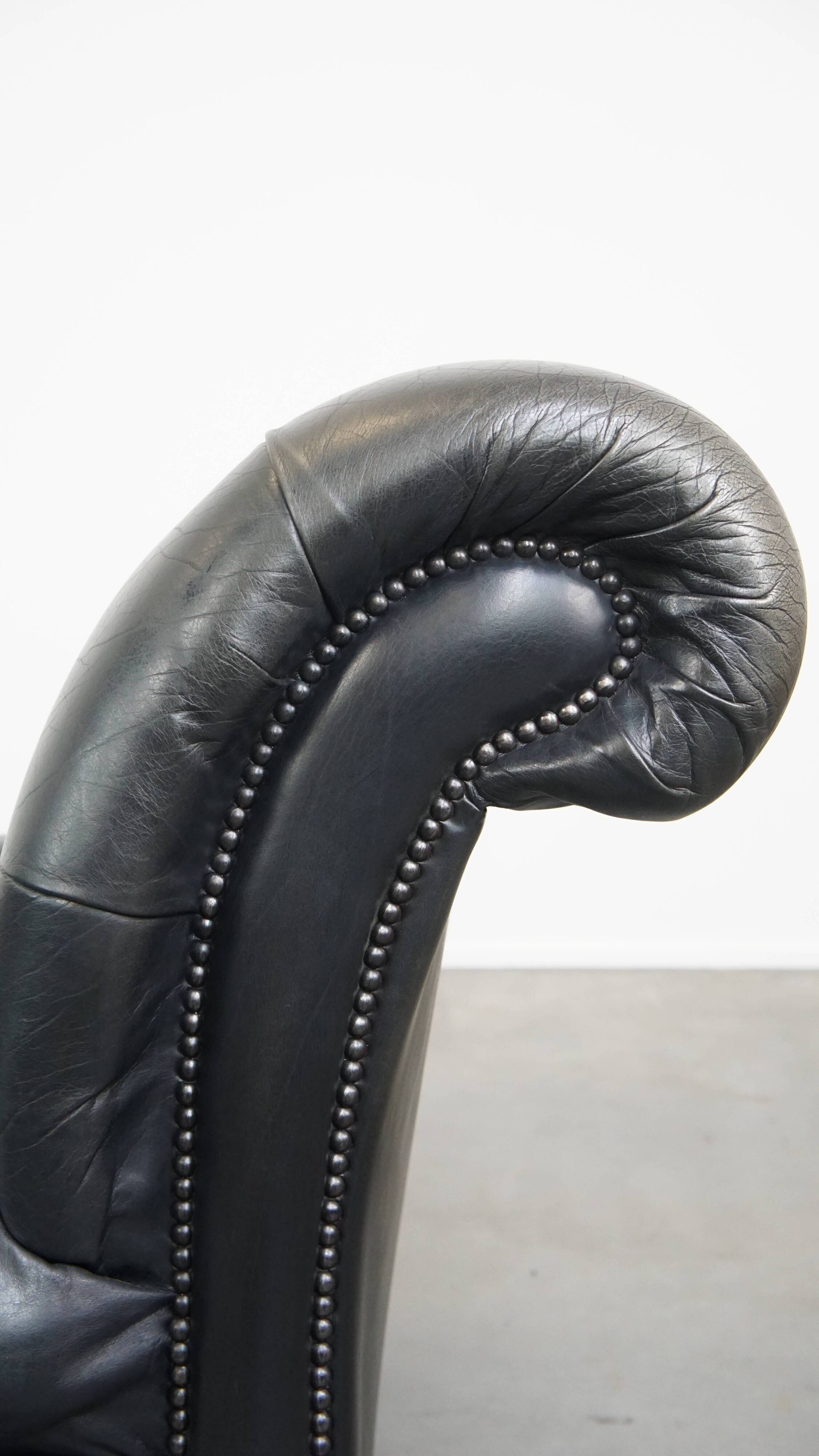 Black chesterfield daybed made of cowhide