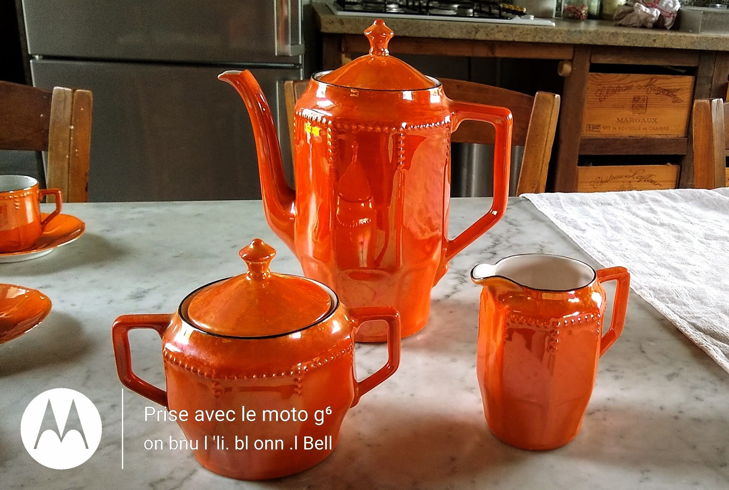 Iridescent orange porcelain coffee set from the 50s-60s with black edging