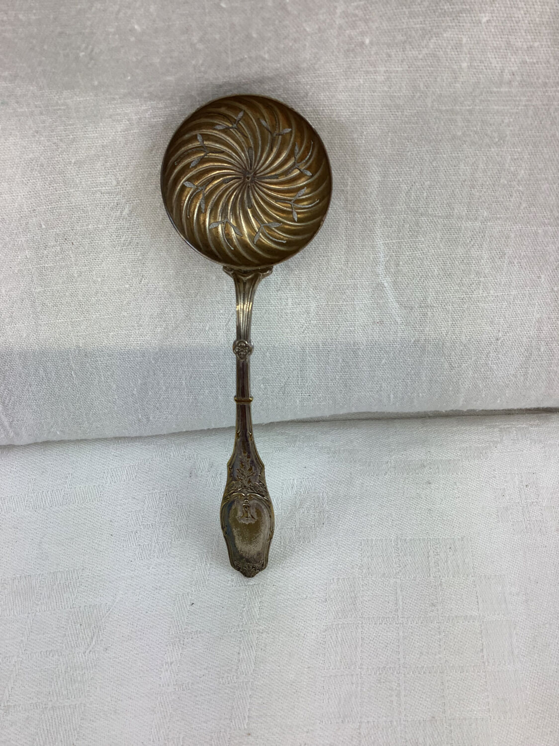 Old sprinkling spoon