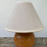 Wooden ball bedside lamp and beige lampshade