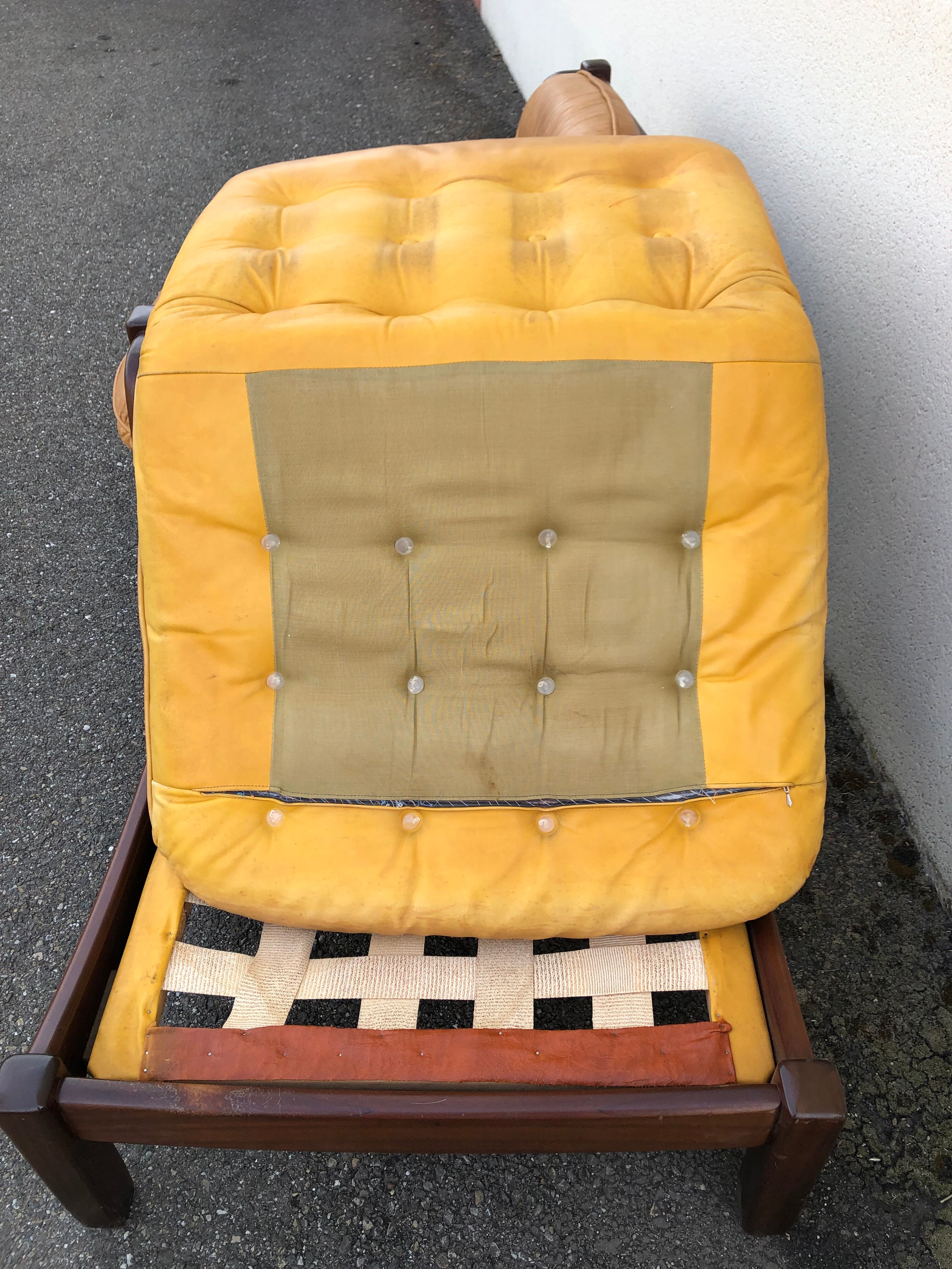 Leather and wood armchairs 70s