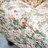 2-seater sofa, floral fabric, wooden structure, plastic and wooden legs, 1970