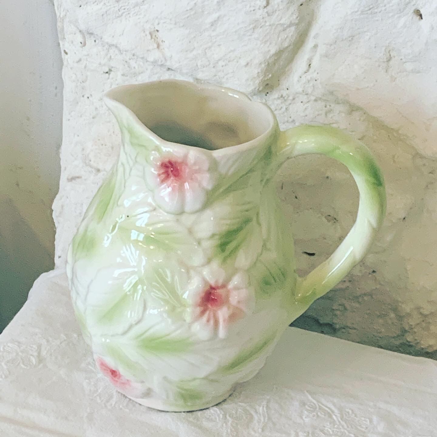 Ceramic dabbling jug enamelled floral motif