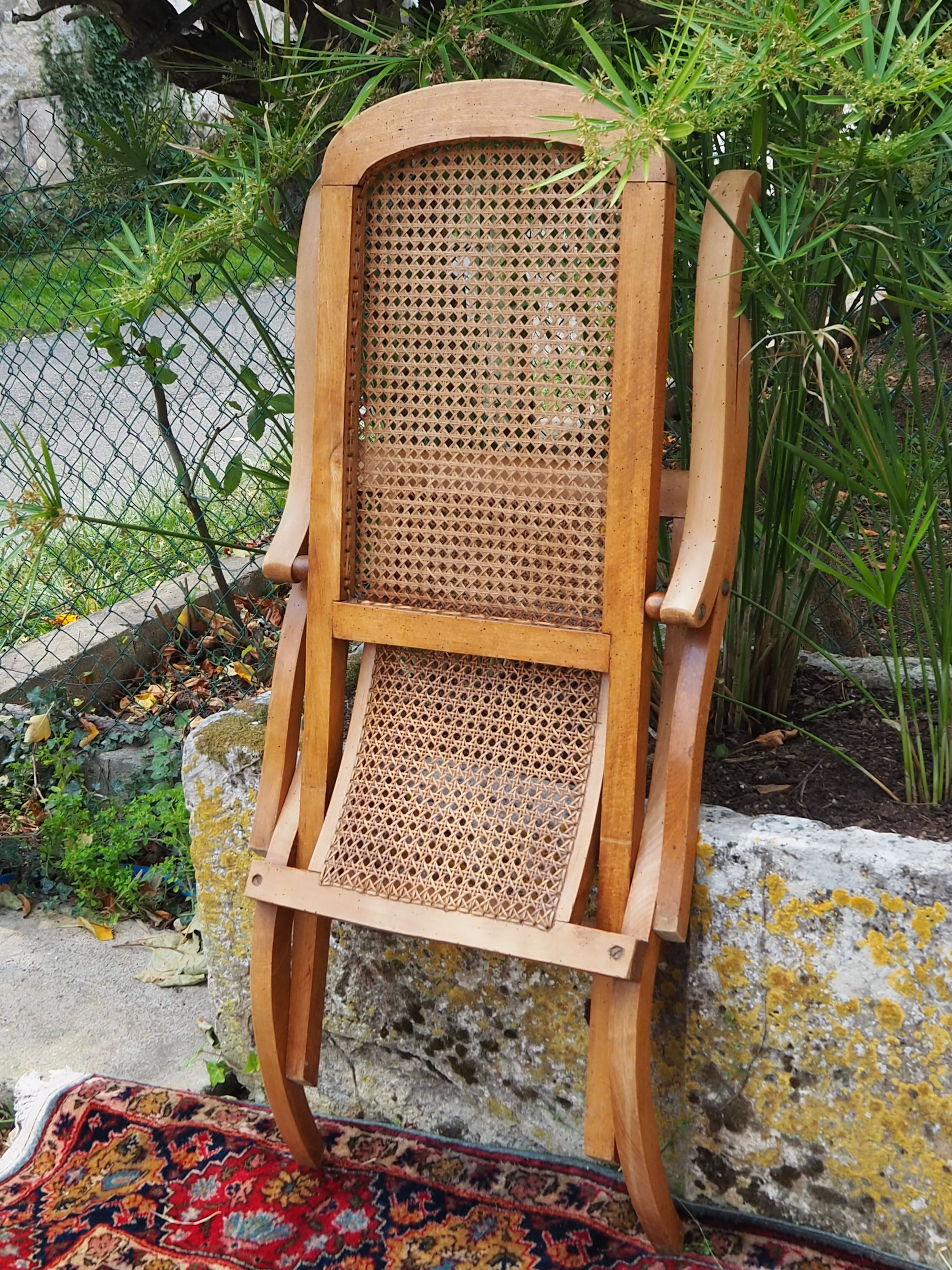 Cane folding armchair in solid wood