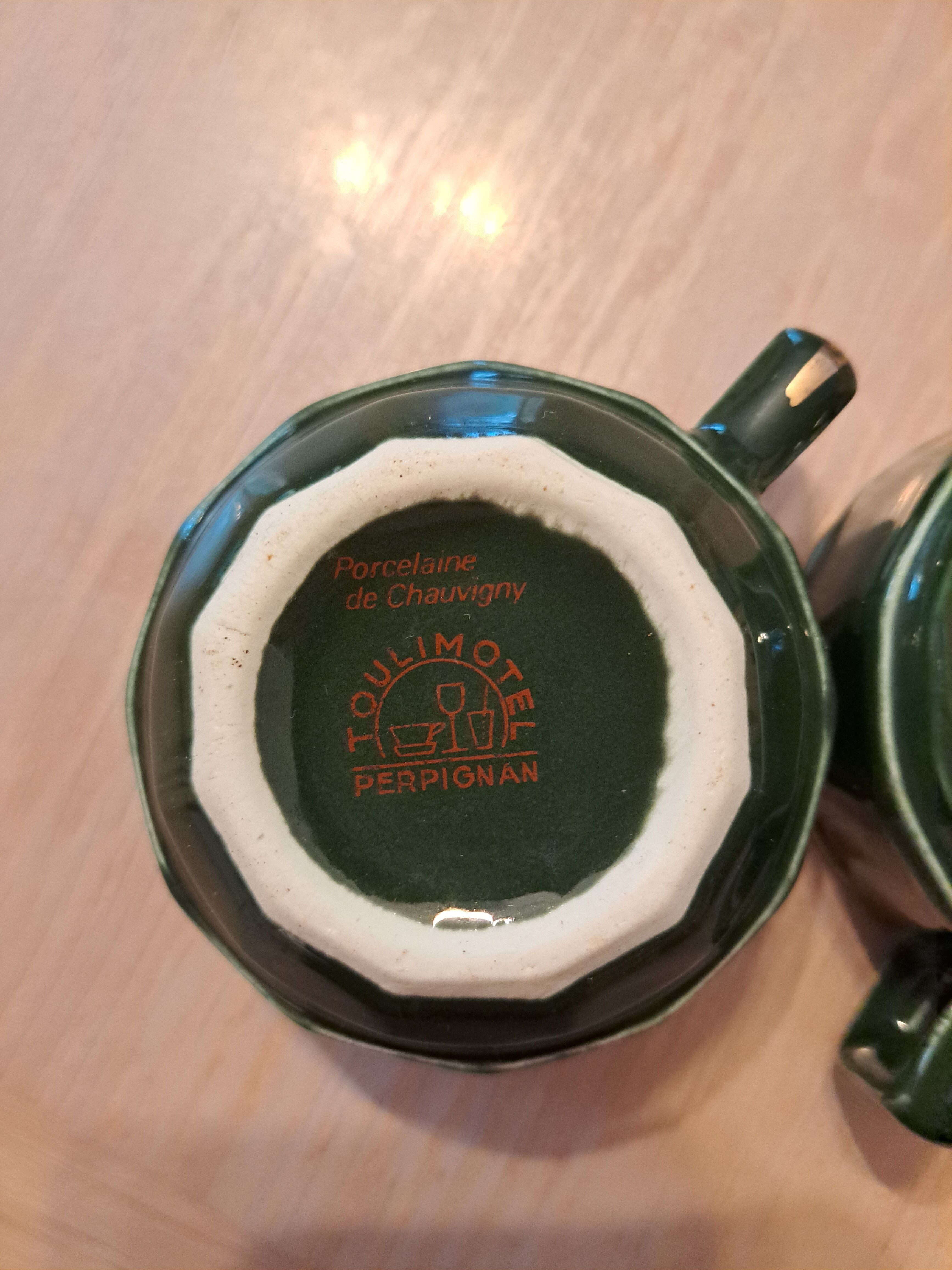 Green and gold coffee cups and sub-cups
