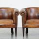 Set of 2 subtle, stately and sturdy club chairs made of sheepskin