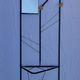 Postmodern entrance wardrobe from the 1980s in black metal and Bakelite, 180 cm.