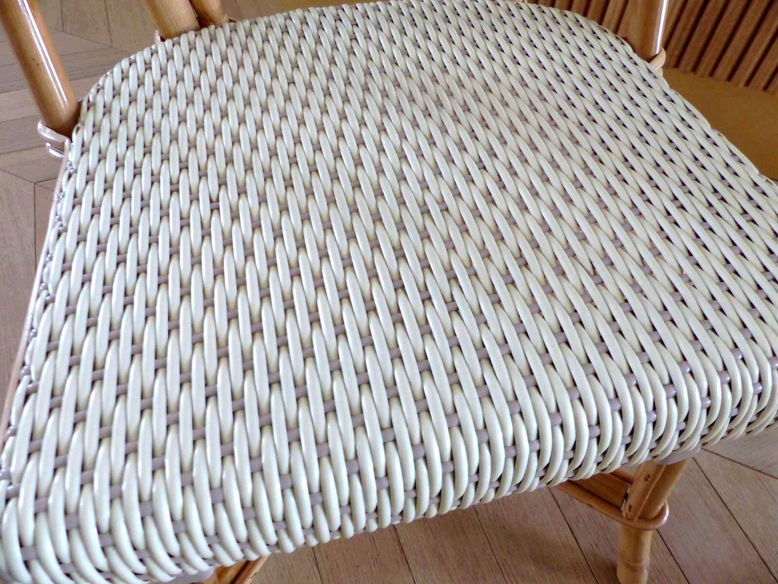 Pair of Parisian bistro chairs from Maison Louis Drucker in light Manila rattan.