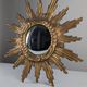 Convex sunburst mirror in carved and gilded wood, 1950s