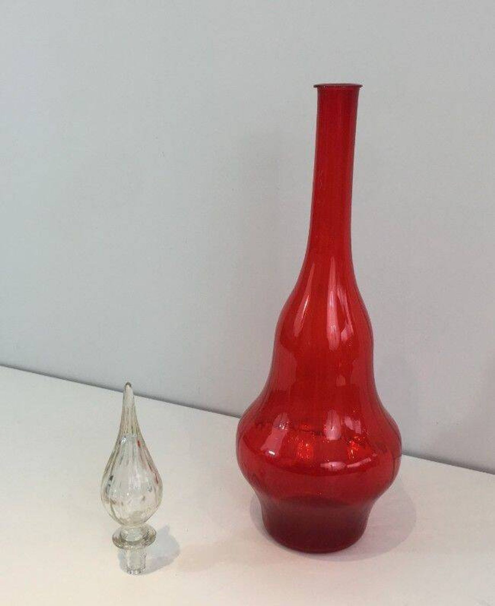 Large designer bottle in red glass