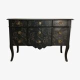 Large black chest of drawers with golden floral decoration