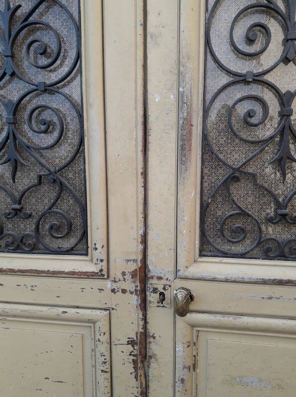 19th century double arched entrance door in oak with grilles and old glass