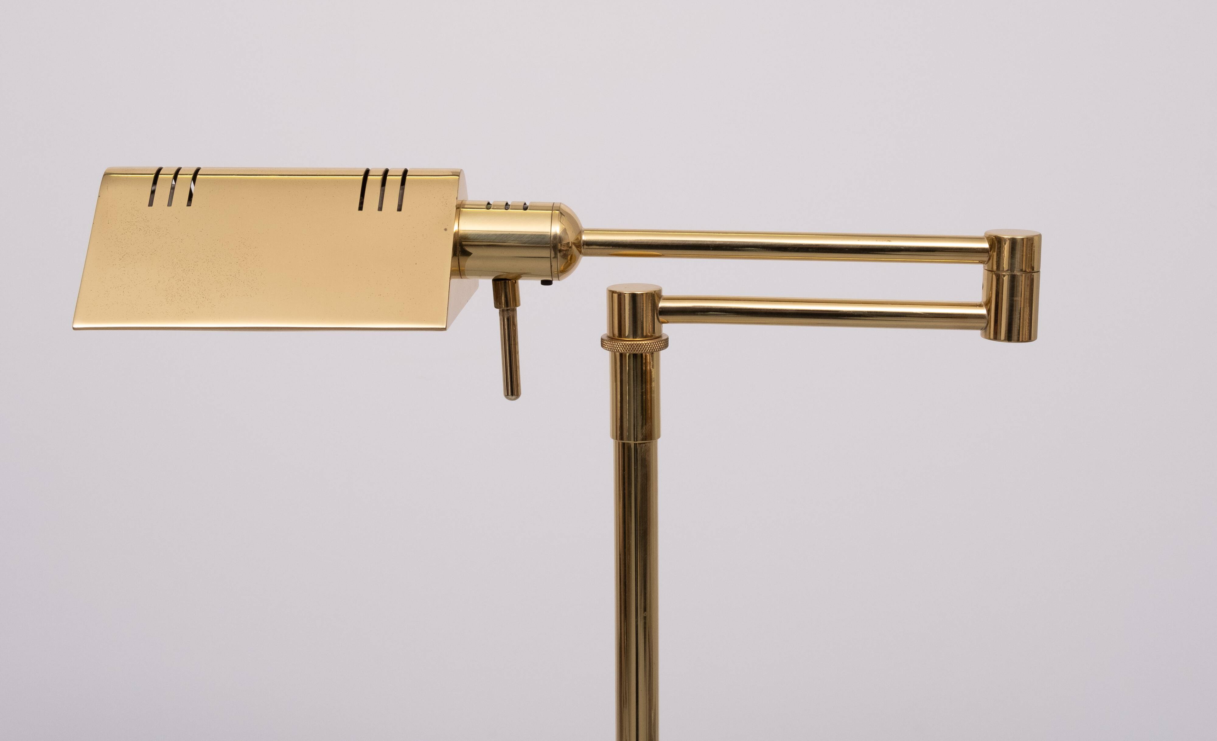 Holtkoetter adjustable Brass swing arm floor lamp. Germany