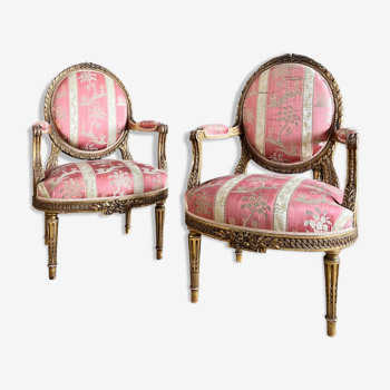Pair of armchairs Medaillons of the Napoleon III period in gilded wood Louis XVI style