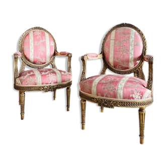 Pair of armchairs Medaillons of the Napoleon III period in gilded wood Louis XVI style