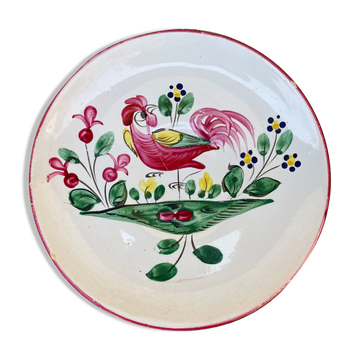 Antique plate with a flower and rooster pattern.