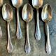 6 small silver metal spoons