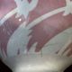 Old footed bowl in earthenware with pink decoration and defects.