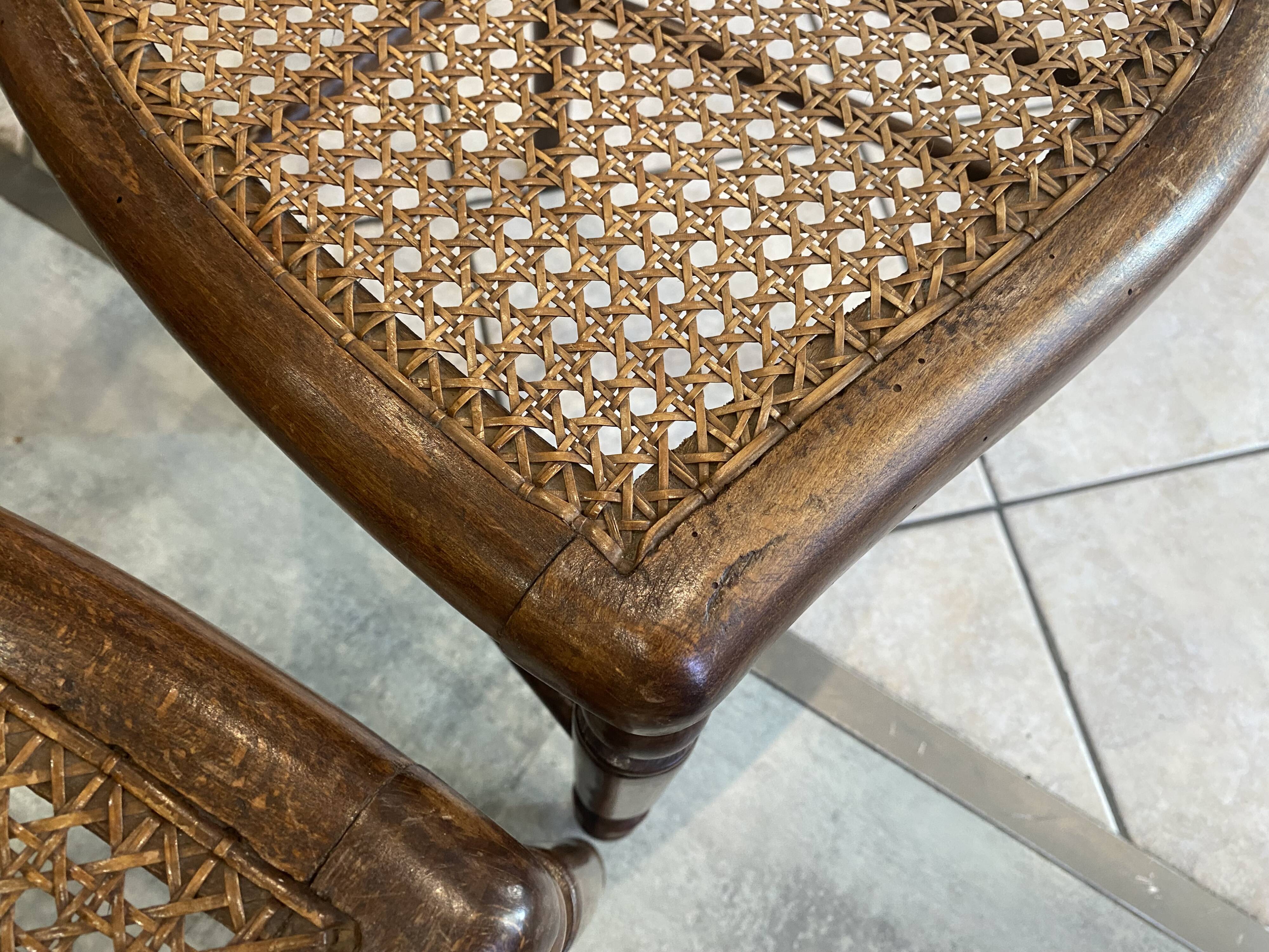 Pair of N2 antique caned and wooden chairs from the 1900s.