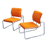 Pair of designer armchairs in orange fabrics and chrome tubes from the 70s
