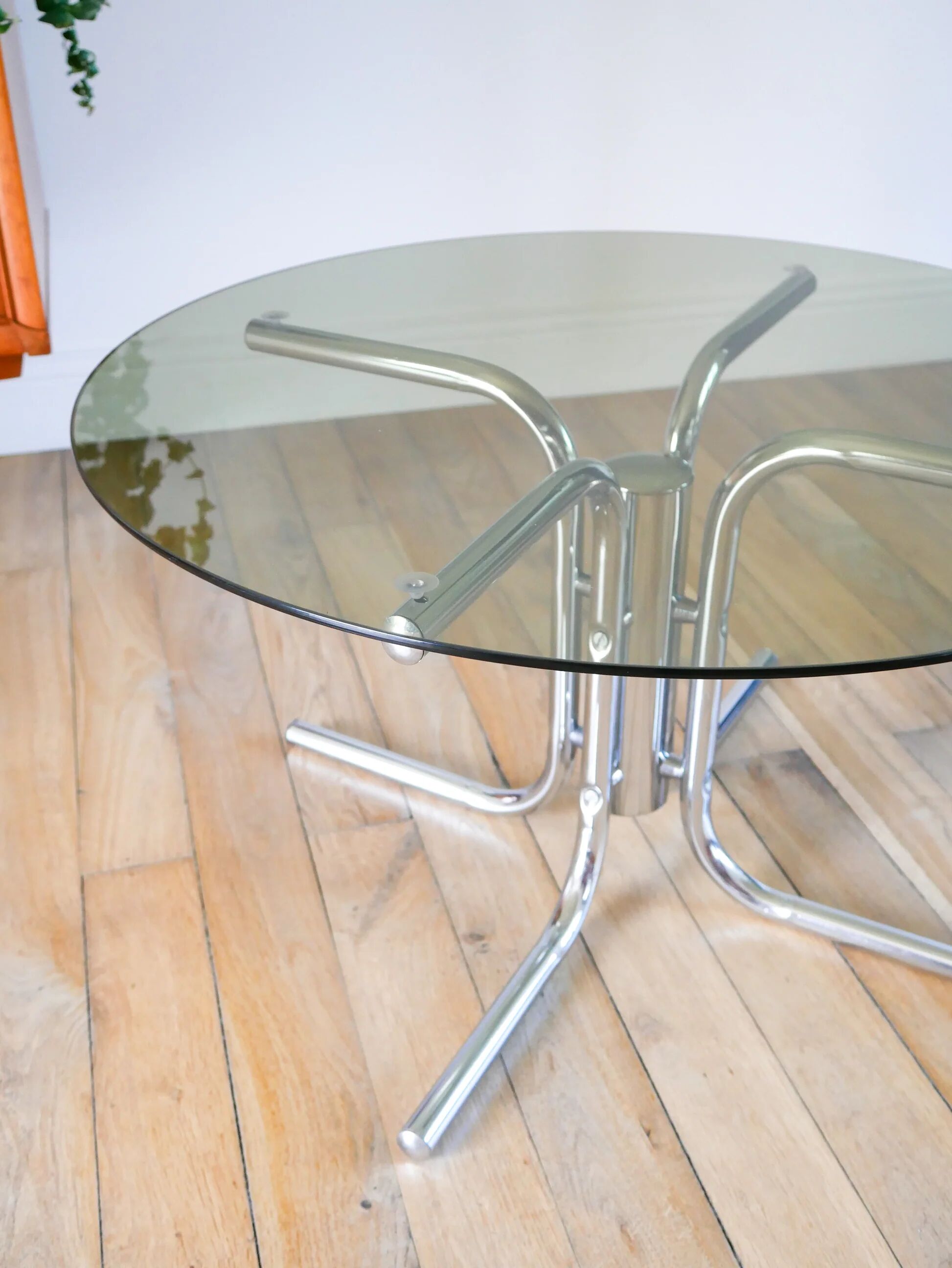 Round coffee table in smoked glass and chrome, star base, design, 1970.