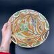 Ancient terracotta dish glazed with polychrome floral decoration, pakistan multan