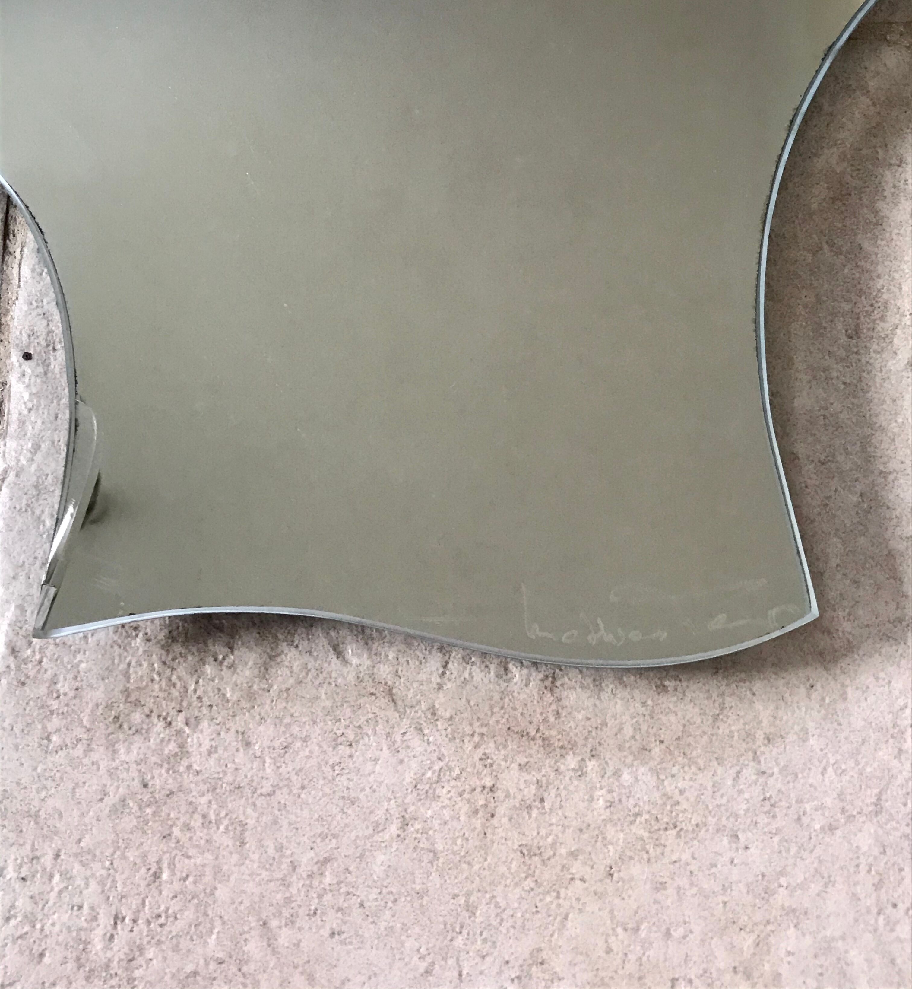 Free-form mirror signed Mathias 55x59cm