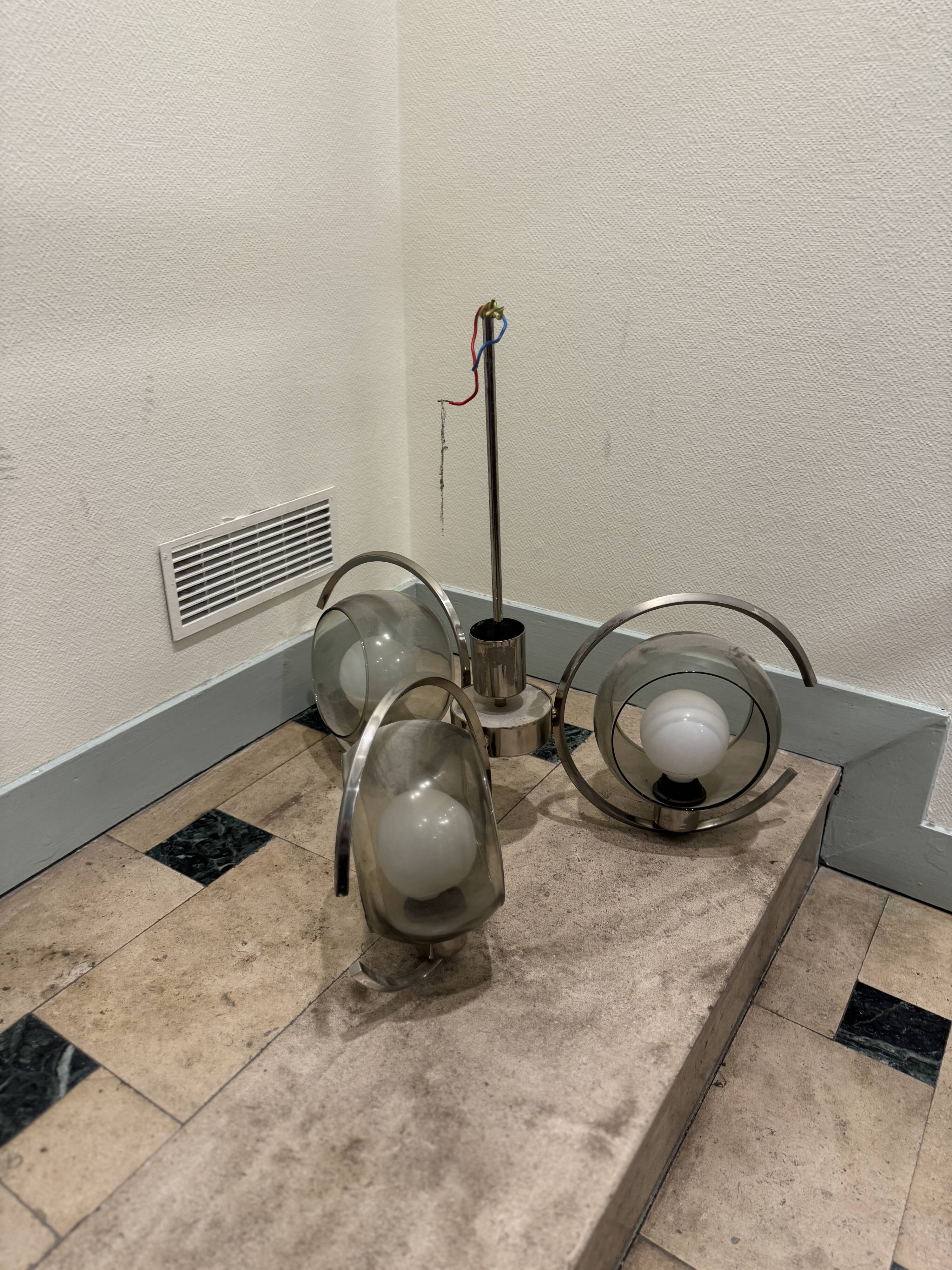 Vintage suspension with 3 smoked glass globes and chrome metal from the 1970s.
