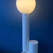 White floor lamp "Close Encounter" and plant stand by Kerst Koopman