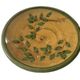Decorative glazed terracotta plate with olive leaf pattern.