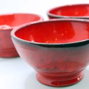 Set of 3 bright red enamelled earth bowls made in France