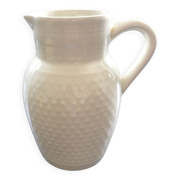 White pitcher with raised dots