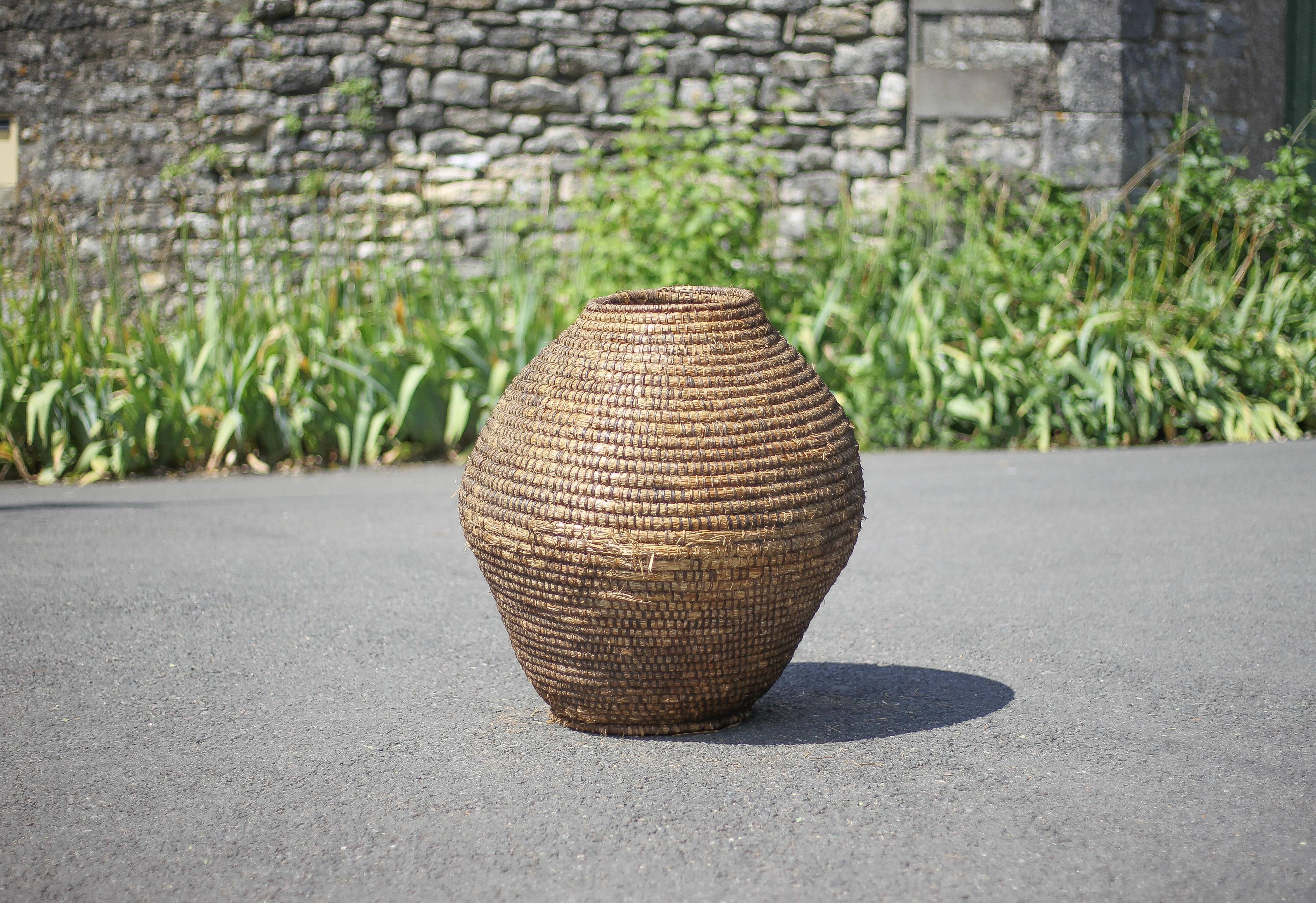 Large old basket, burgundy straw and bramble, woven basket
