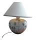 Antique ceramic lamp with a floral design.