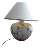 Antique ceramic lamp with a floral design.