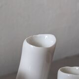 set of decorative vases composed of 11 white ceramic soliflores, evoking the delicate appearance of coral. In good general condition, despite some chips. Dimensions: 29.5 * 5.2 * 11.5 cm.