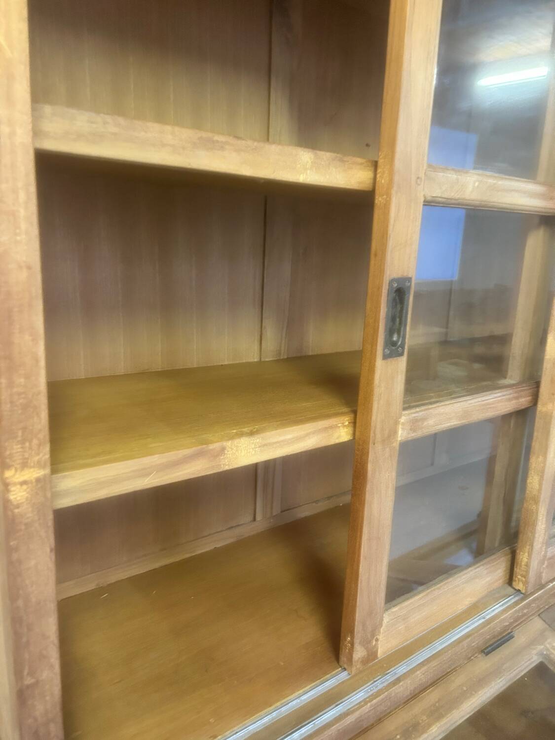 Large antique haberdashery cabinet with glass doors.