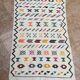Handwoven Berber kilim rug: small Moroccan decorative rug.