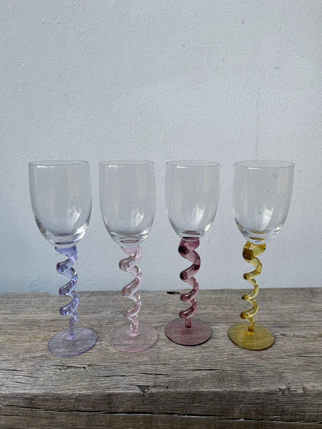 4 large, multicoloured, twisted champagne flutes