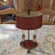 Old silver-plated bronze lamp, except for the arms which are not silver.