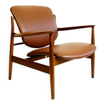 Danish modern armchair made of teak wood and brown leather by Finn Juhl for France and Son.