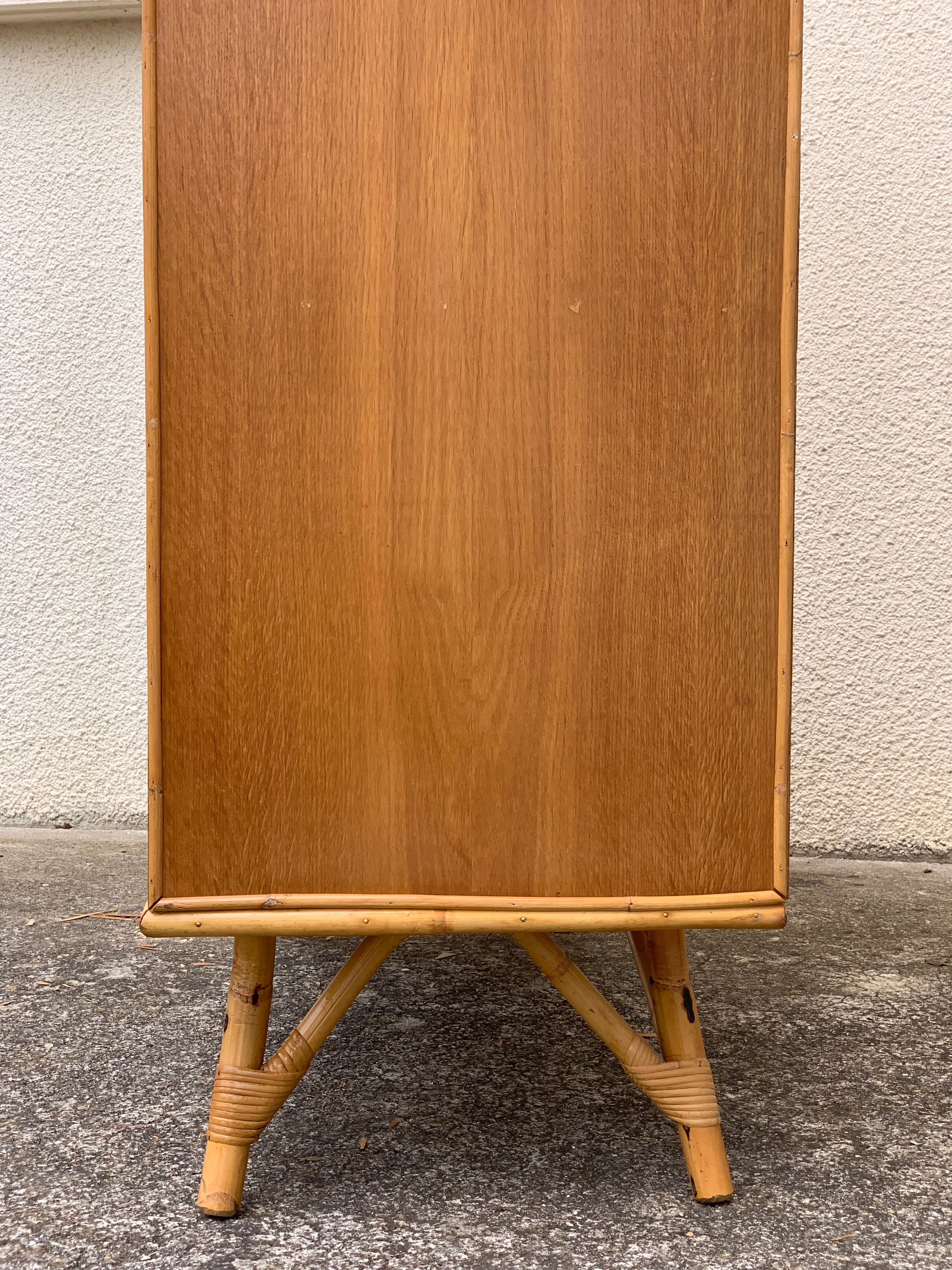 Rattan wardrobe with tapered legs from the 1960s.