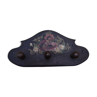 flower-coated wooden coat holder